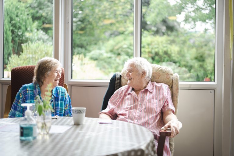 This is an image of two people at a day centre.