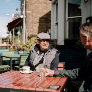 Image of two men at a pub